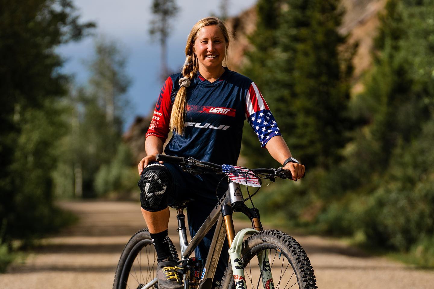 Amy Morrison sitting on mountain bike