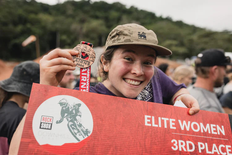 Martha Gill posing with medal