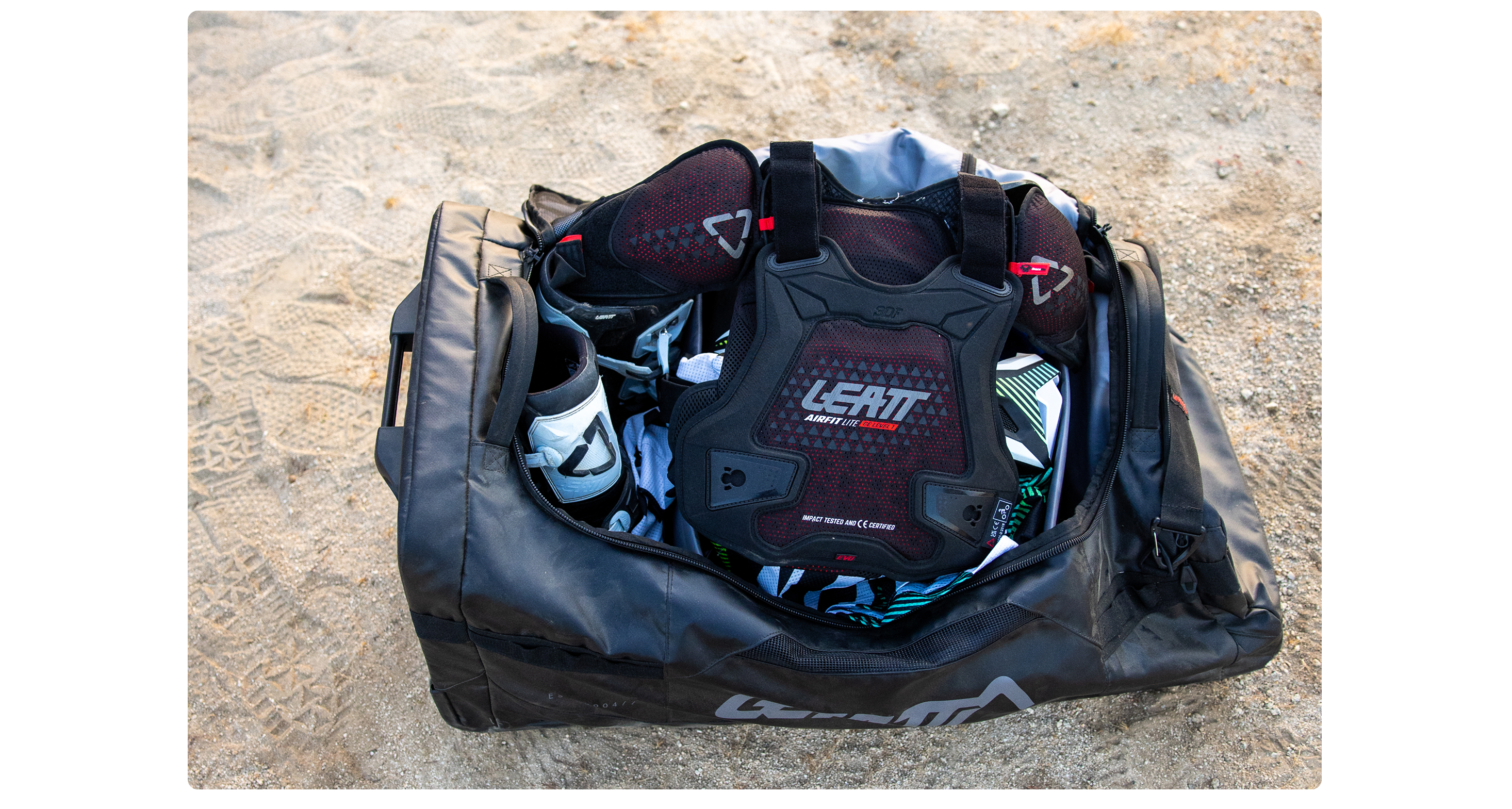 Chest protector laying on top of a full Leatt kit bag