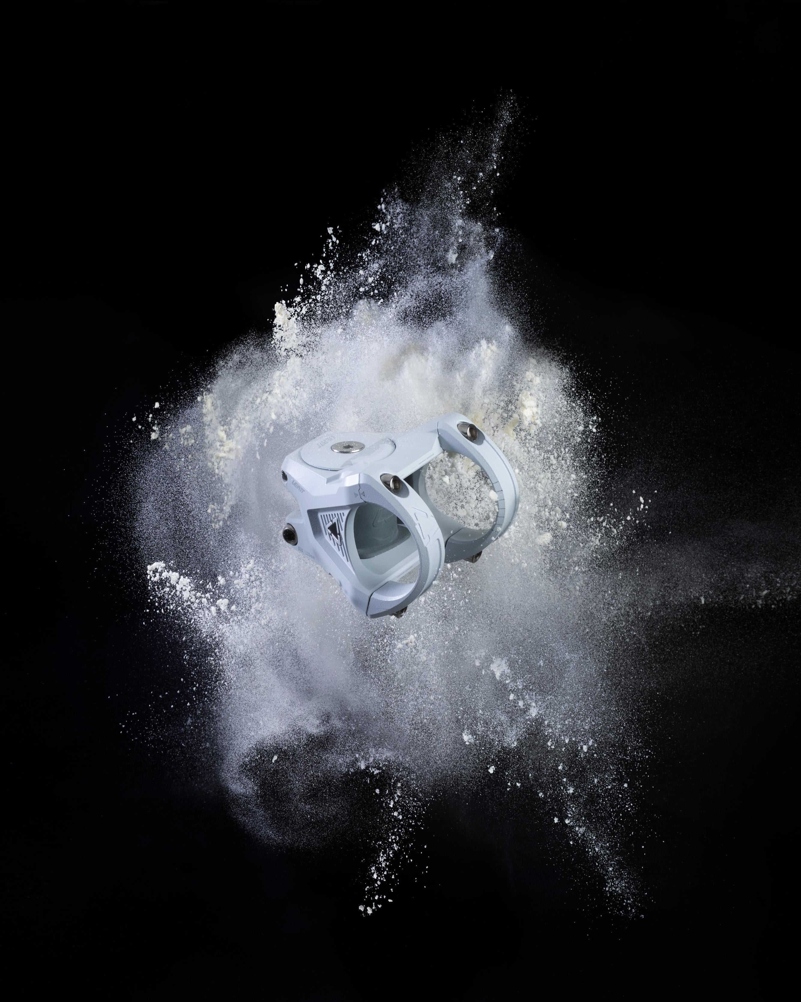 White stem with dust particles on a black background