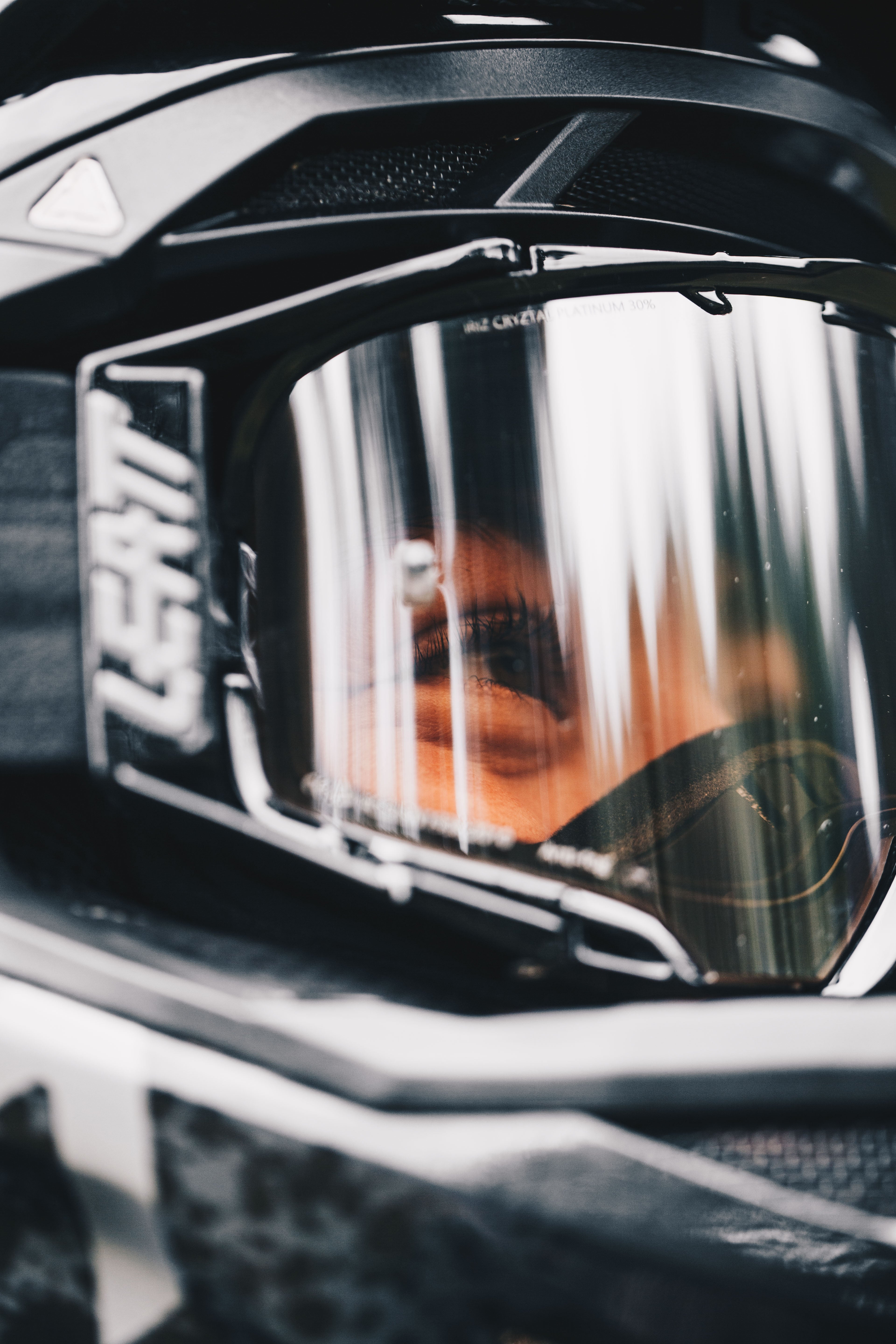 Close-up of a motorcycle helmet with a reflective visor