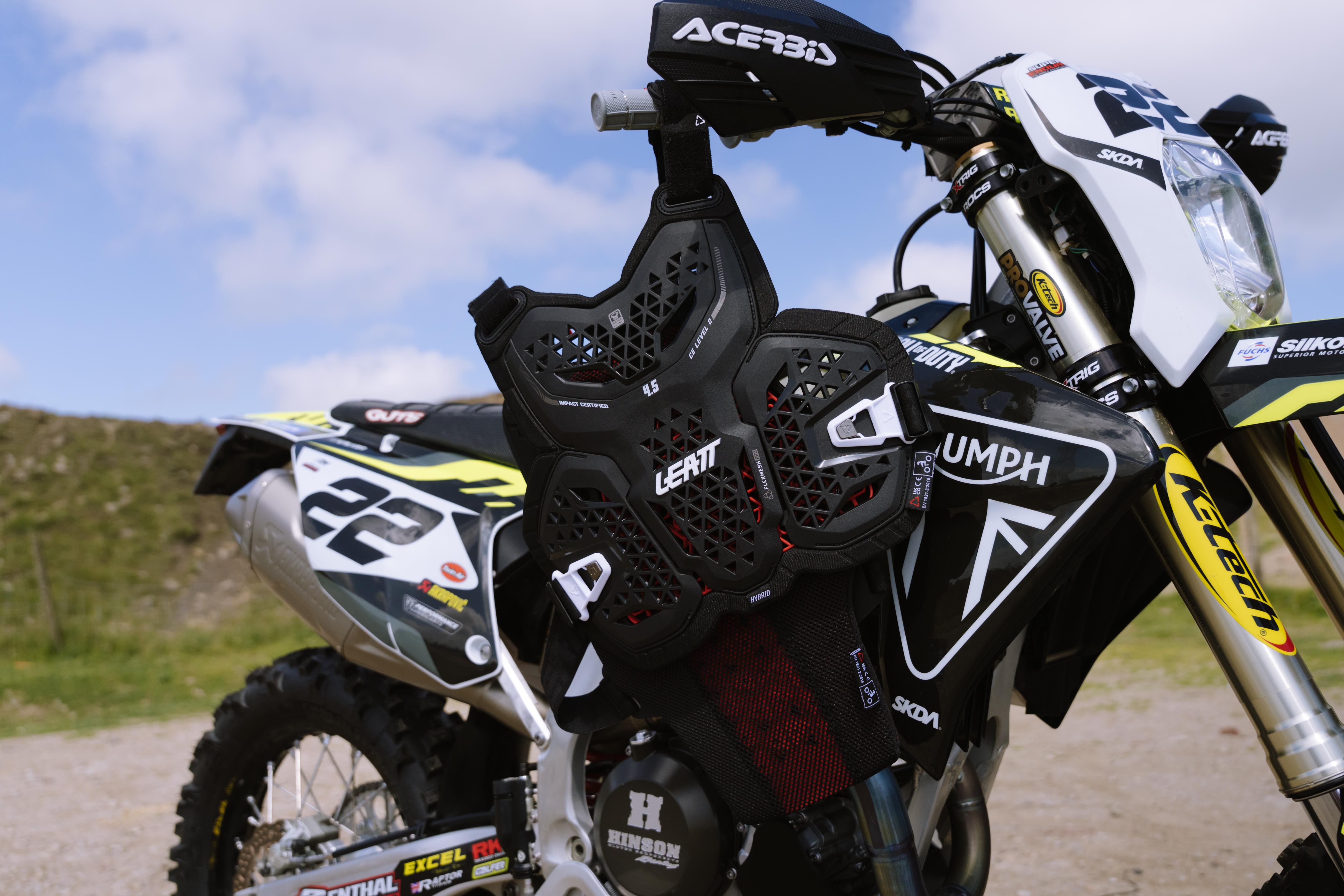 Motorcycle with visible branding on a dirt road